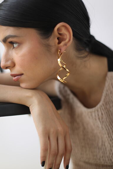 bold curved hoops in large size perfect to elevate your style to next level available in 22k gold and silver finish